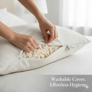 A removable, machine-washable bamboo cover being zipped onto a shredded memory foam pillow.