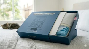 A 4K photorealistic close-up showing a luxury, gold-embossed presentation box partially open to reveal the premium cooling pillow, branded specifically for the British sleep market.