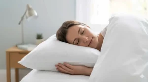 A relaxed person resting their head comfortably on a plump, breathable dust mite proof pillow.