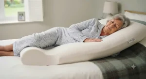 A foam positioning pillow used to maintain a comfortable side-lying position for pressure relief.