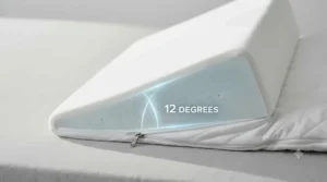 Profile view of a supportive wedge pillow for GERD showing the gradual incline used to reduce night-time heartburn.