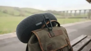 Lightweight neck pillow clipped securely to the outside of a rucksack for a weekend break.