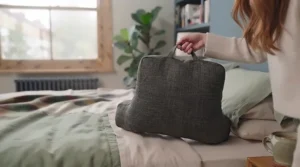 Built-in carry handle on a lightweight large reading pillow with arms, making it easy to transport around the house.