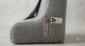 Handy side pocket on a reading pillow for back pain storing reading glasses.