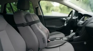Back massage pillow installed on a car driver's seat for long-distance driving comfort.