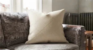 A set of coordinating square cushions creating a cohesive look on a living room sofa.