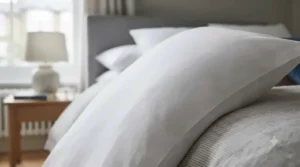Close-up view of 100% cotton European square pillowcase fabric texture in crisp white.