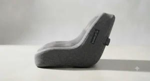 Side profile showing the contoured memory foam shape of a back massage cushion.