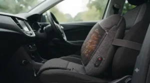 Soft, breathable mesh fabric cover of a massage pillow being unzipped for easy machine washing.