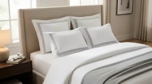 Classic bordered oxford pillowcases creating a luxury hotel style appearance on a guest bedroom bed.