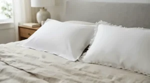 An oxford pillow for decorative bedding showing its distinctive fabric border compared to standard pillows